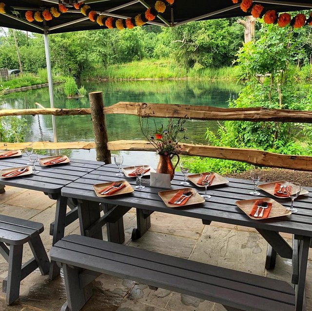 Picnic table dining set up by a lake